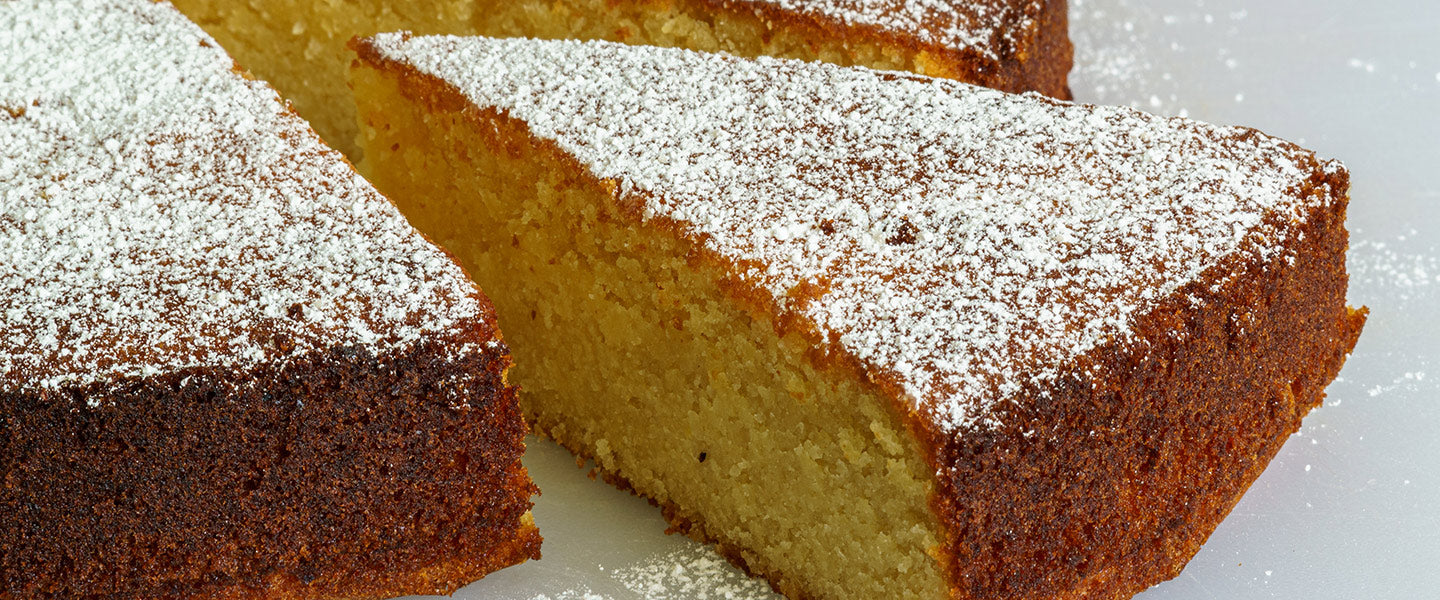 A cut piece of Olive Oil Cake