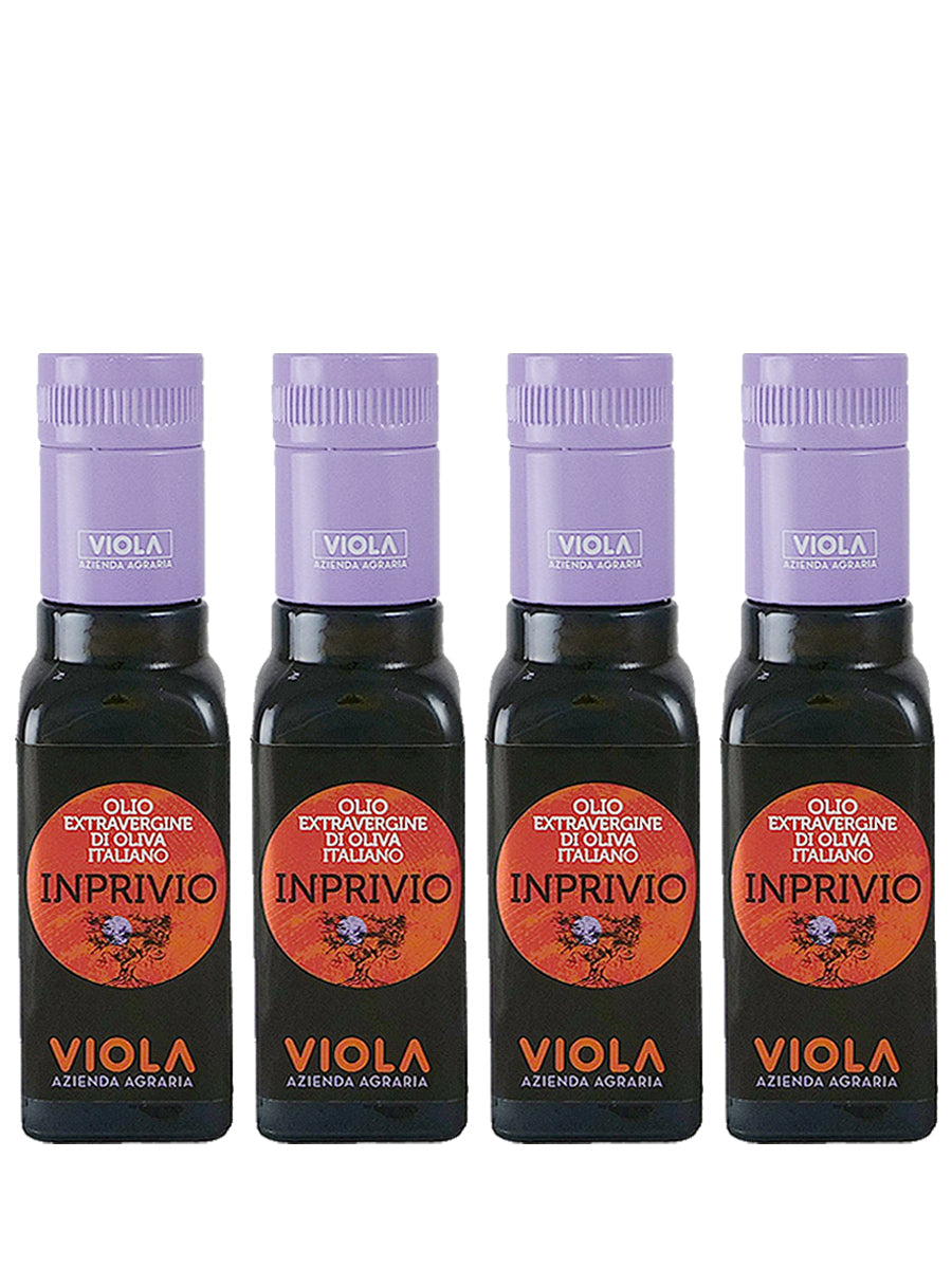 4 glass bottles of extra virgin olive oil