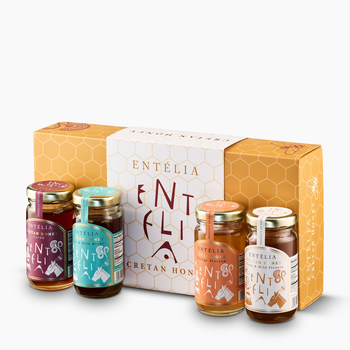Four 100 g Entelia Cretan honeys; Carob, Pine & Wild Herbs, Orange Blossom, and Thyme & Wild Flowers, with gift box.