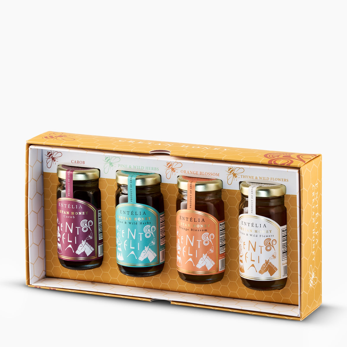 Open Entelia gift box with four 100 g jars of Cretan honeys; Carob, Pine & Wild Herbs, Orange Blossom, and Thyme & Wild Flowers.