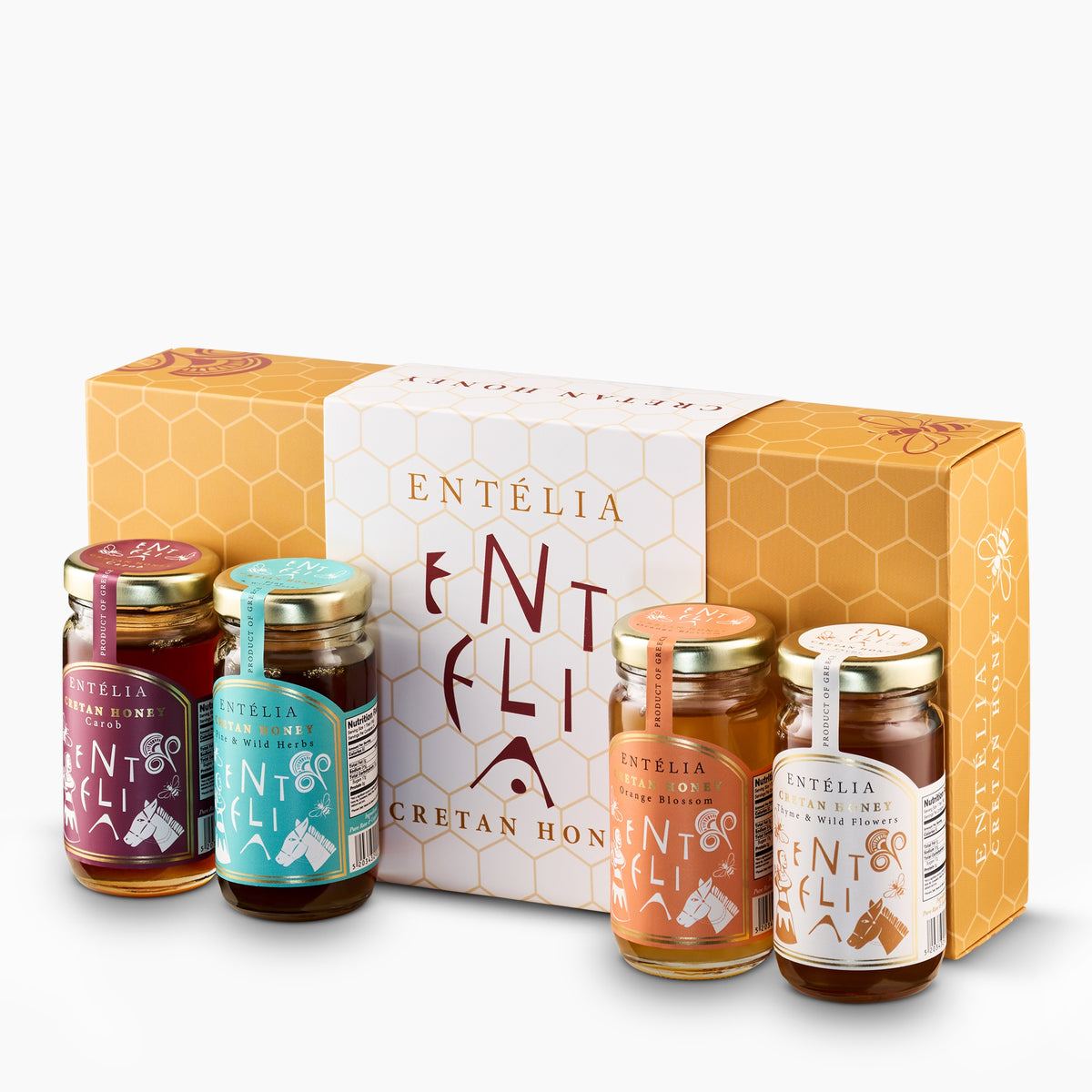 Four 100 g Entelia Cretan honeys; Carob, Pine & Wild Herbs, Orange Blossom, and Thyme & Wild Flowers, with gift box.