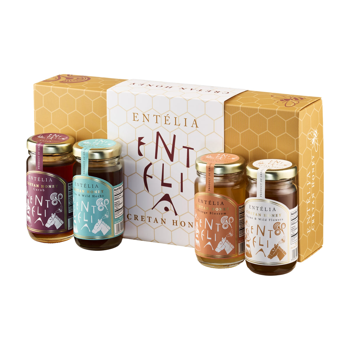 Four 100 g Entelia Cretan honeys; Carob, Pine & Wild Herbs, Orange Blossom, and Thyme & Wild Flowers, with gift box.