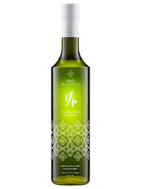 Green glass bottle of Oro del Desierto 1/10 Novello, made from green Picual olives from Andalusia, Spain.
